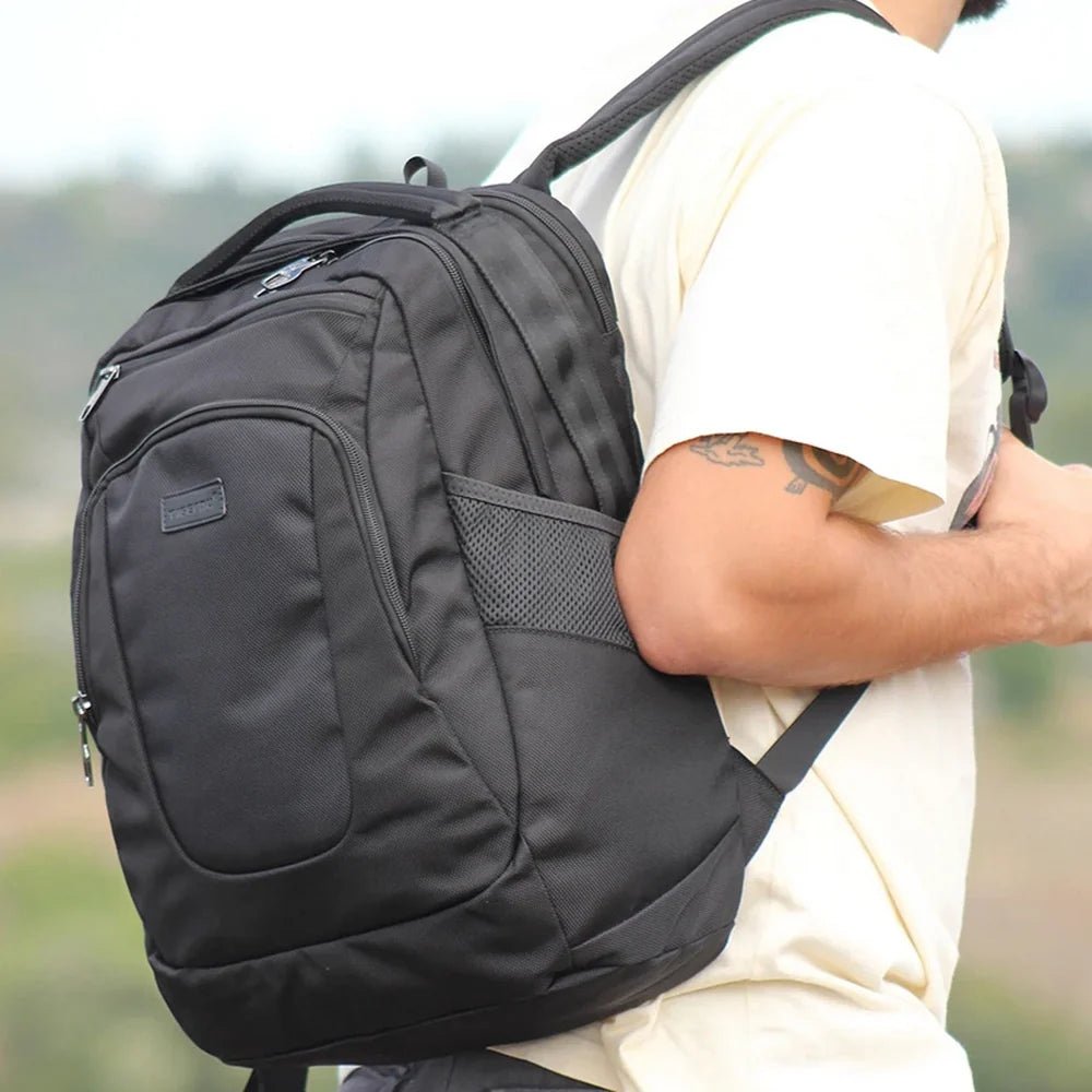 Sac à dos homme pc portable en tissu noir avec plusieurs compartiments zippés