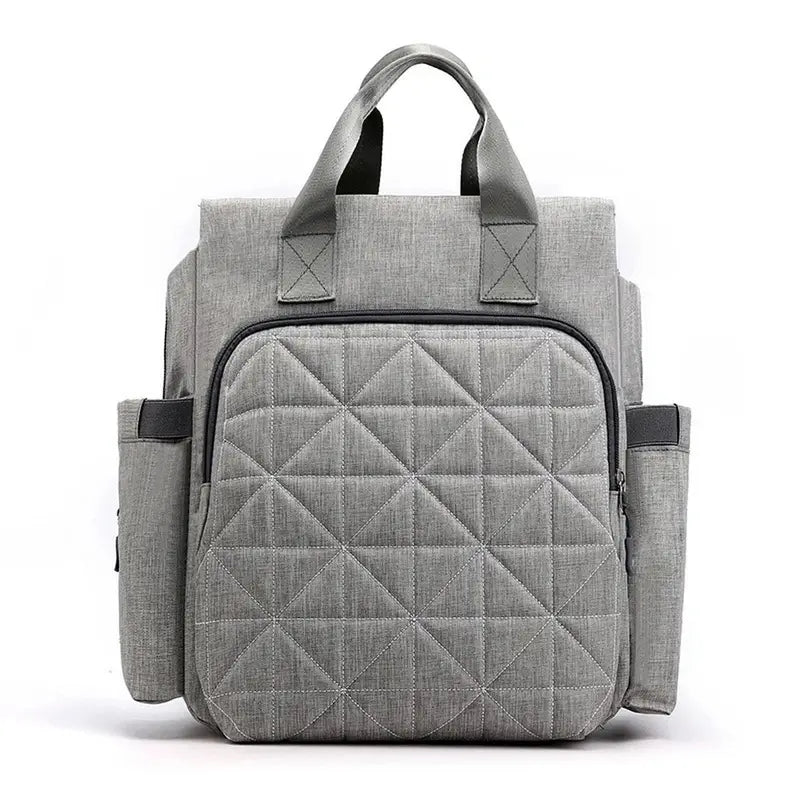 Sac à dos à langer bébé gris avec quilting, poignées supérieures et poches latérales