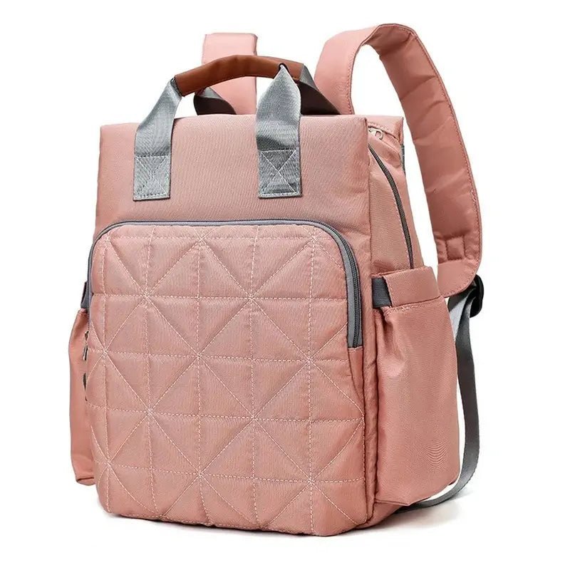 Sac à dos à langer bébé en rose poussière avec poche quiltée et poignées hautes