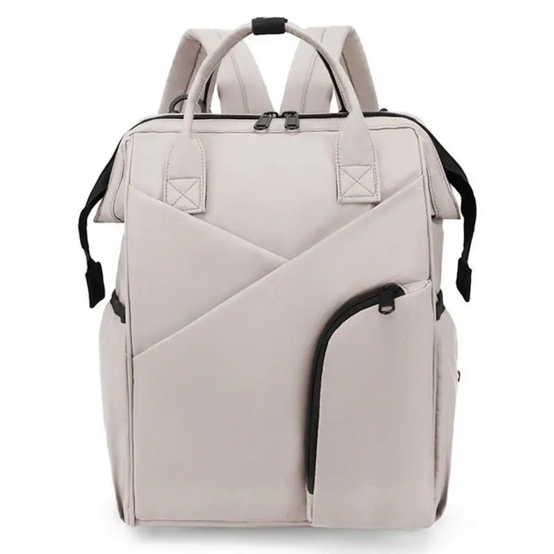 Sac à dos à langer chic gris clair convertible avec plusieurs poches pour maman