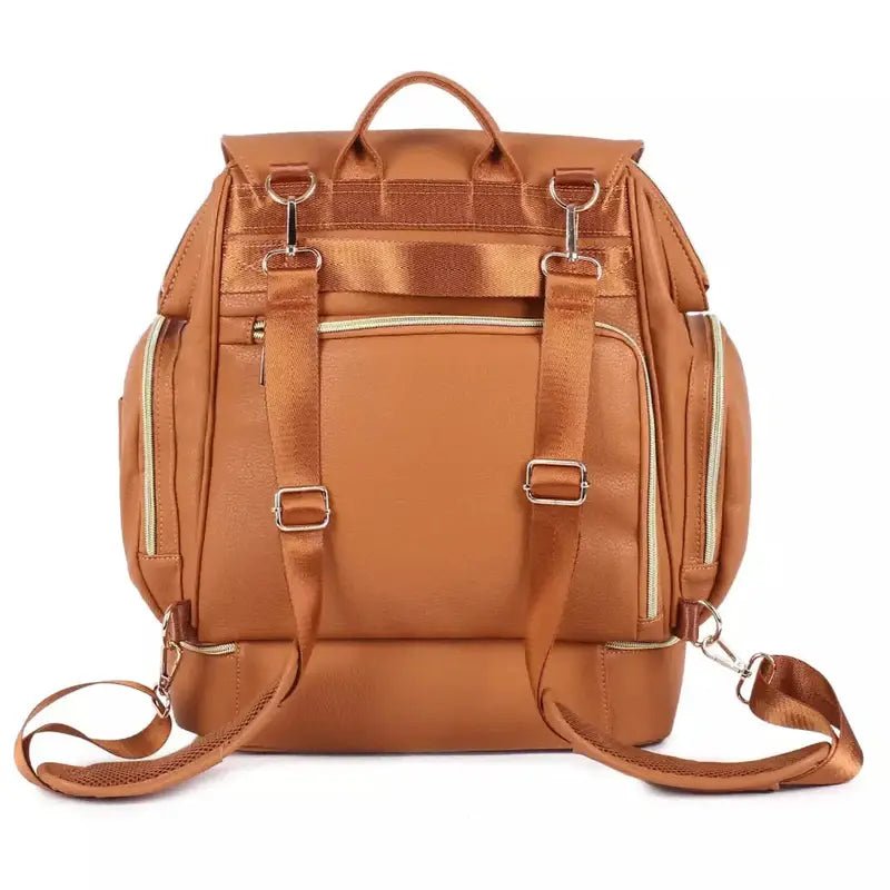 Sac à dos à langer cuir en cuir brun avec fermoirs et zips en or