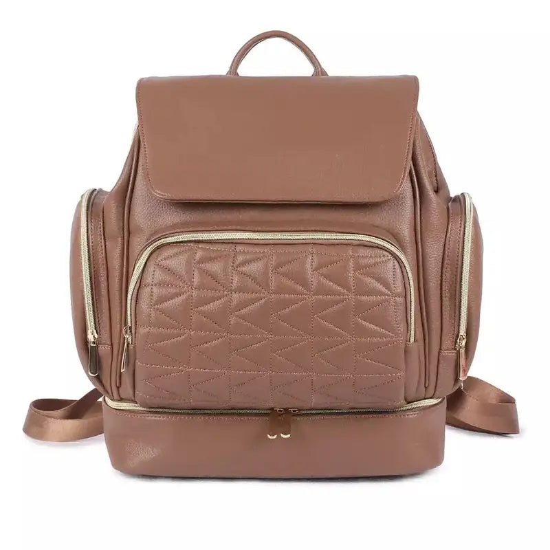 Sac à dos à langer en cuir marron avec poche avant matelassée et zips dorés