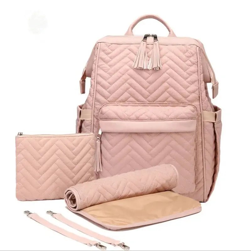 Sac à dos à langer design en quilté rose blush avec tapis à langer et accessoires