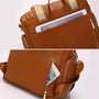 Sac à dos à langer en cuir marron avec poches zippées pour tablette et téléphone