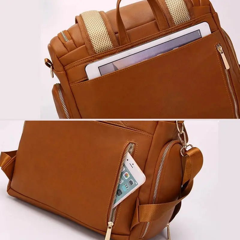 Sac à dos à langer en cuir marron avec poches zippées pour tablette et téléphone