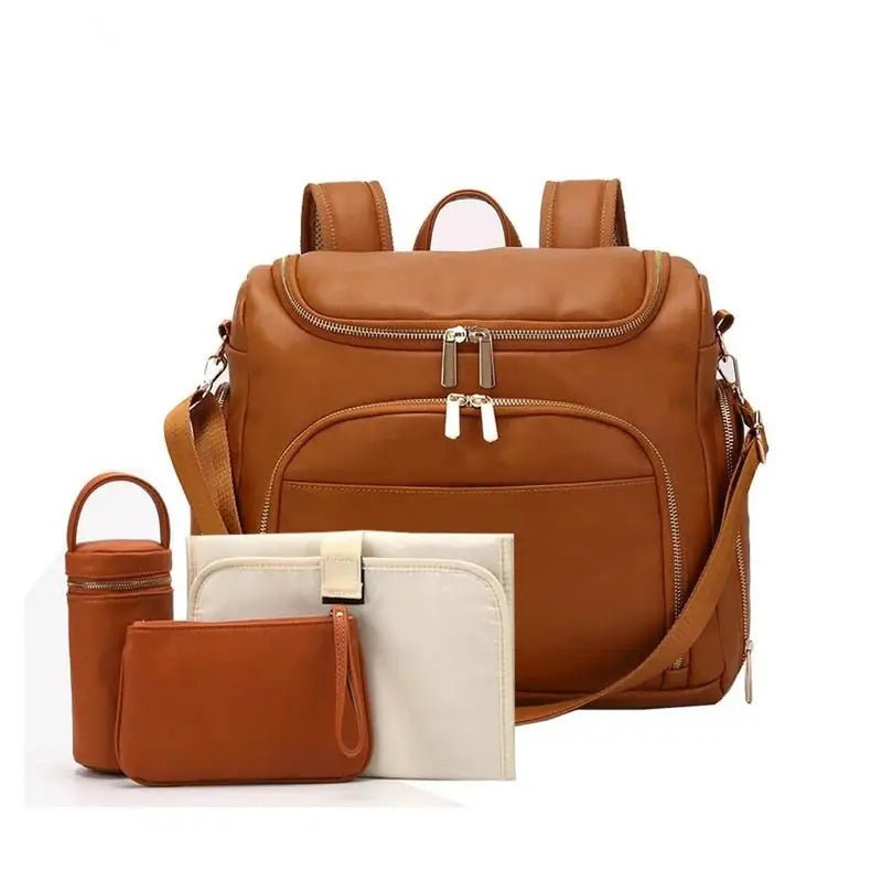 Sac à dos à langer en cuir marron avec accessoires assortis pour bébé