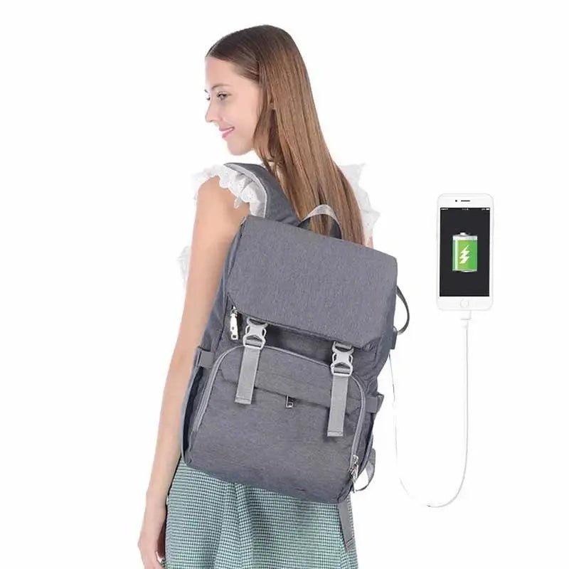 Sac à dos à langer ergonomique gris avec port de chargement USB intégré