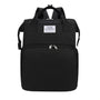 Sac à dos à langer extensible en nylon noir avec poignées supérieures et plusieurs compartiments zippés