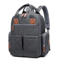 Sac à dos sac à langer gris foncé matelassé avec accents en cuir marron