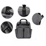 Sac à dos à langer gris en tissu avec multiples poches et détails près de fonctionnalités