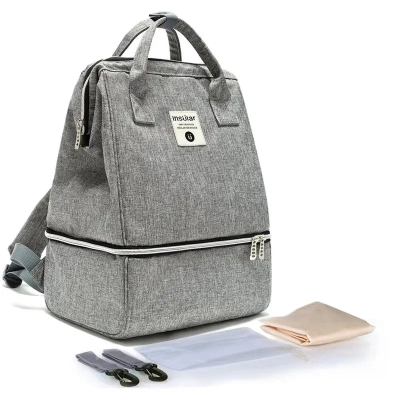 Sac à dos à langer imperméable en tissu gris avec deux compartiments et poignées supérieures