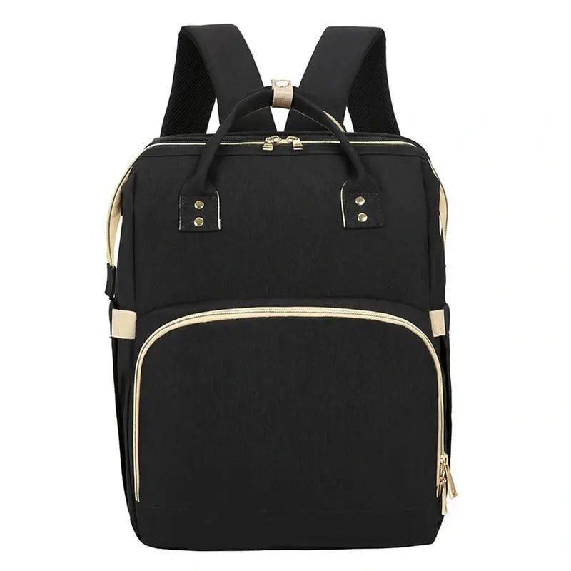 Sac à dos à langer lit noir avec accents dorés et multiples compartiments