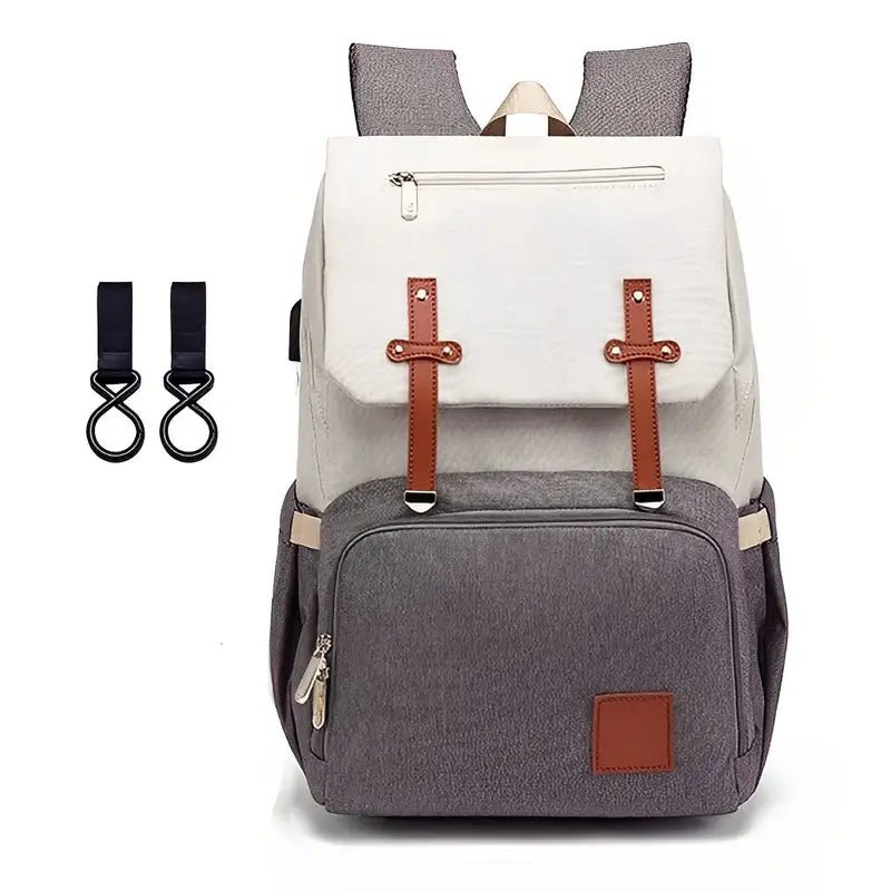 Sac à dos à langer Oxford gris et crème avec bretelles en faux cuir marron et crochets de poussette