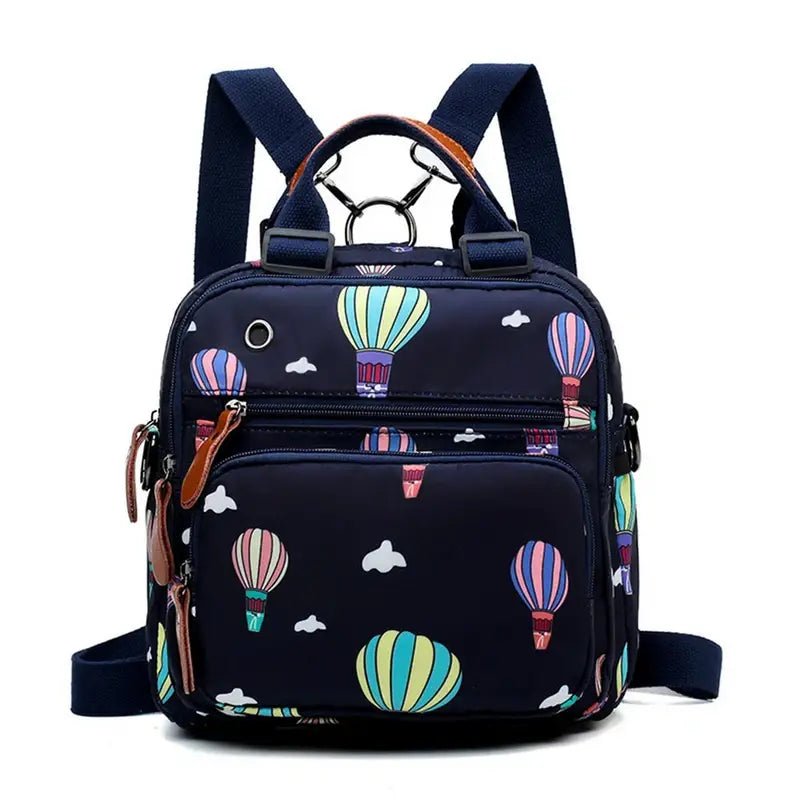 Sac à dos à langer en nylon bleu foncé avec motifs de montgolfières et nuages