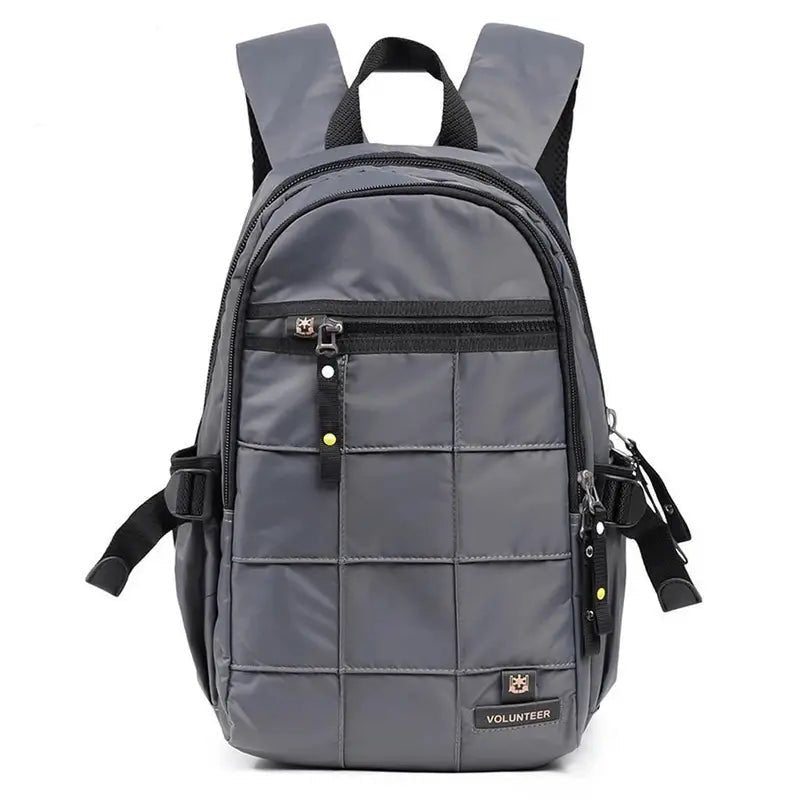 Sac à dos multi rangement gris en nylon matelassé avec plusieurs compartiments zippés