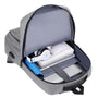 Sac à dos ordinateur usb gris ouvert avec appareils électroniques et parapluie à l’intérieur