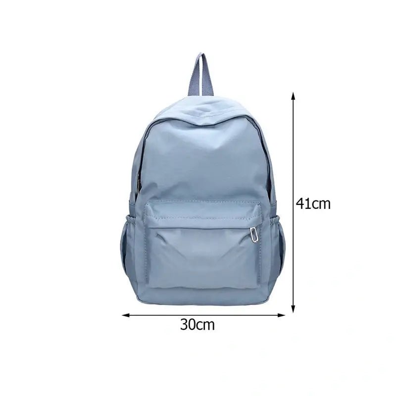 Sac à dos petite fille en nylon bleu clair avec poche avant et poches latérales