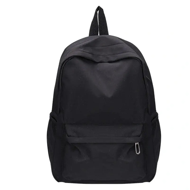 Sac à dos petite fille minimaliste en nylon noir avec poche zippée frontale