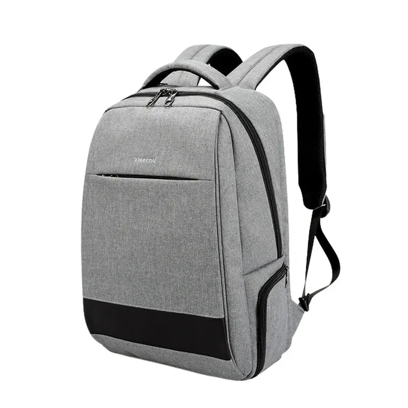 Sac à dos pour ordi portable en tissu gris clair avec accents noirs et multiples poches zippées