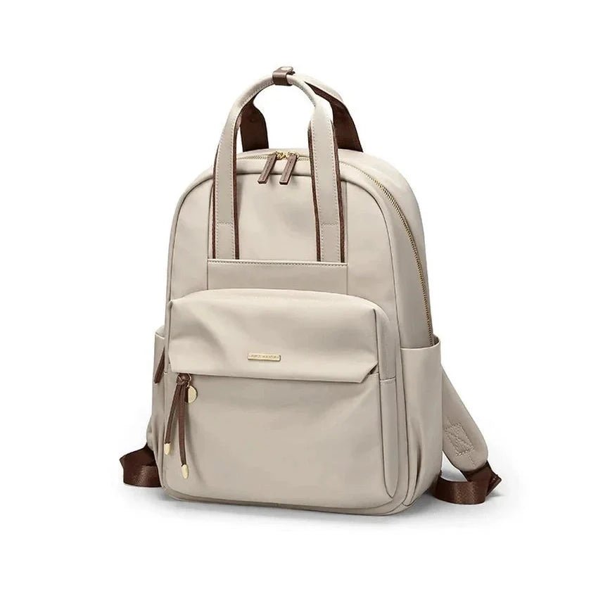 Sac à dos pratique pour femme en beige clair avec bretelles marron et fermetures dorées
