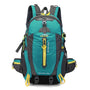 Sac à dos randonnée femme 40l en teal et gris avec accents jaunes et plusieurs compartiments