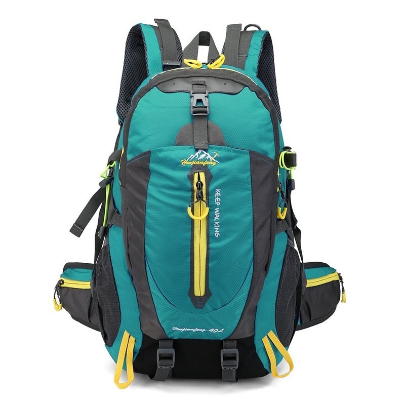 Sac à dos randonnée femme 40l en teal et gris avec accents jaunes et plusieurs compartiments