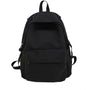 Sac à dos scolaire en tissu noir avec poches zippées et bretelles ajustables