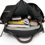Sac à dos Sirocco en nylon noir avec fermetures dorées et accents cuir marron