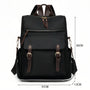 Sac à dos Sirocco en toile noire avec accents cuir marron et quincaillerie dorée