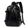Sac à dos urbain pour femme en cuir noir avec multiples zippers et boucles