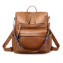 Sac à dos vintage femme en similicuir marron avec sangle tissée colorée et fermetures éclair multiples