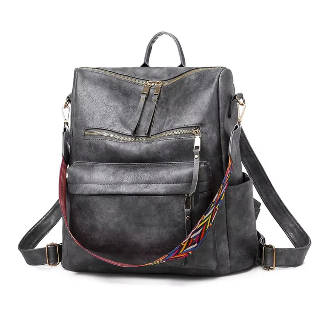Sac à dos vintage femme en similicuir gris foncé avec sangle tissée colorée et compartiments zippés