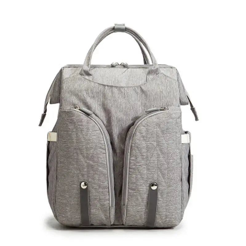 Sac à langer sac à dos gris en tissu avec poches zippées et poignées supérieures