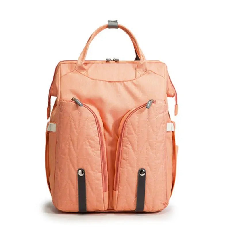 Sac à langer sac à dos lit en peach avec poches zippées et poignées supérieures