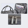 Sac à langer sac à dos lit gris foncé avec plusieurs compartiments et zippers solides
