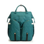 Sac à langer sac à dos lit en tissu teal matelassé avec plusieurs poches