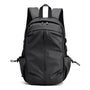 Sac d école collège noir en nylon avec multiples compartiments zippés et poches latérales