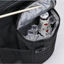 Sac isotherme bandoulière 27L ouvert avec bouteille et glaçons à l’intérieur