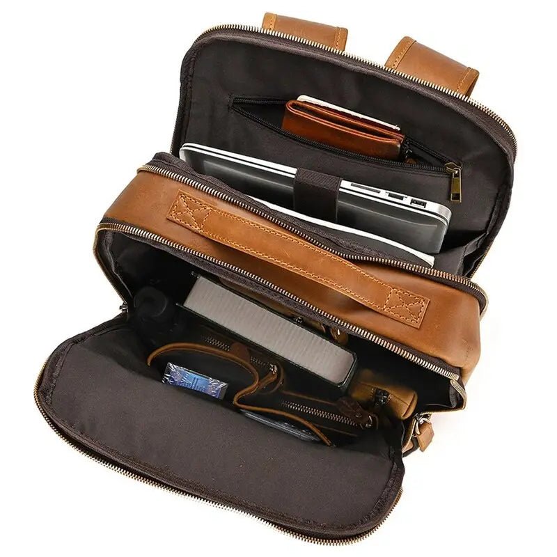 Sac ordinateur pour femme de luxe en cuir marron ouvert avec plusieurs compartiments et un ordinateur portable
